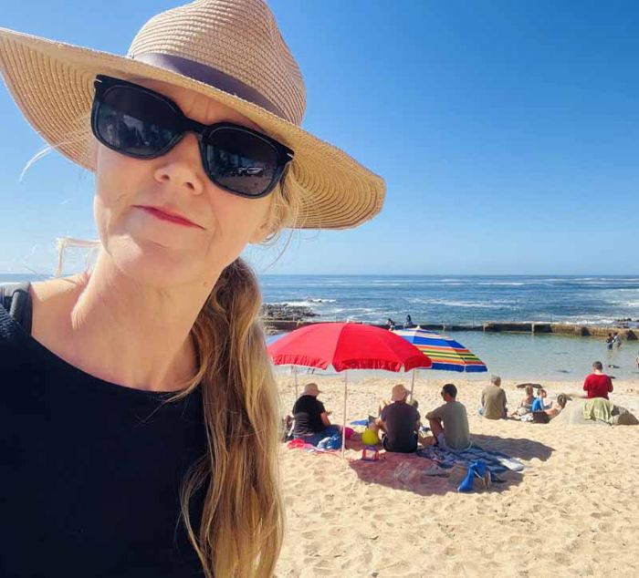 Andrea Rowlands-Bradfield, host of Villa Palmera, on the beach at Mossel Bay
